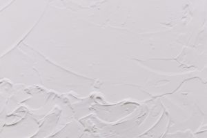 Picture of An uneven plaster surface that requires sanding.